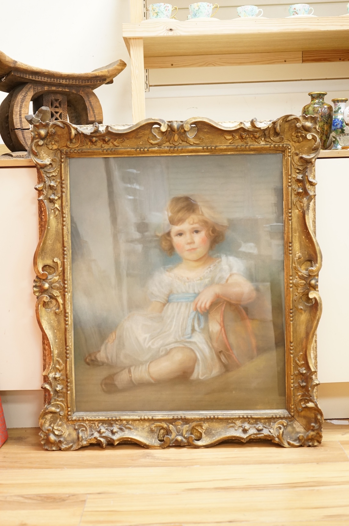 English school, mid 19th century, Portrait of a young girl holding a tambourine, pastoral on paper laid on canvas, 73 x 60cm, ornate gilt frame
